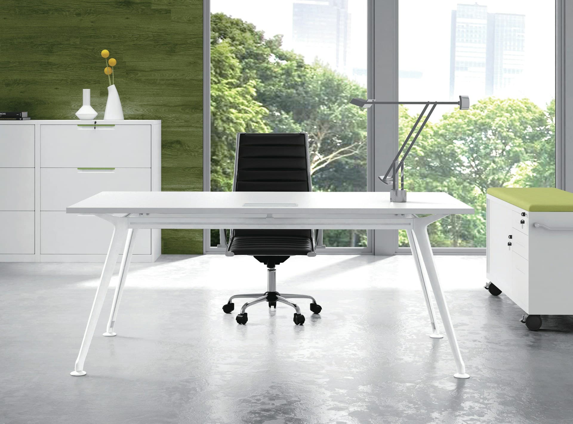 white office desk with black chair in a modern workspace