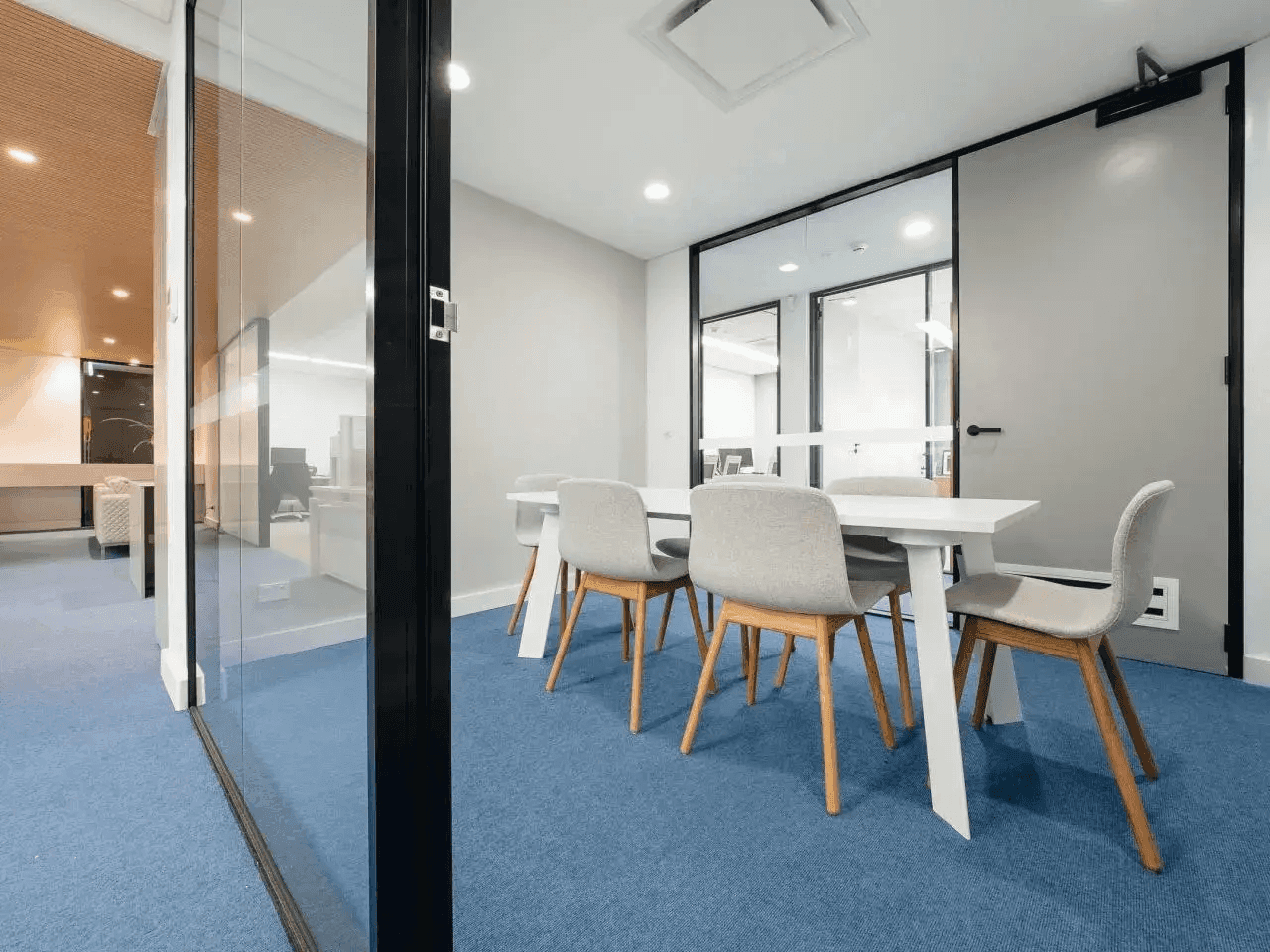 Smart small office fitout with space-efficient design and glass partitions